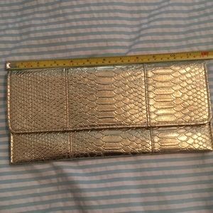 Gold snakeskin clutch